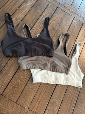 Vuori Sports Bra Trio in Black, Oregano, and Mineral